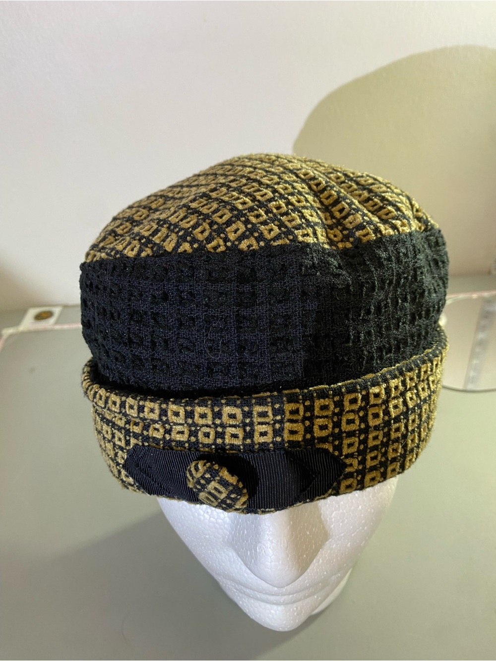 L’Accessoirie hat Textured Black and Gold Knit Beanie with Decorative Band